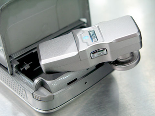 Illustration for article titled Cellphone's Secret Compartment Stores Bluetooth Headset, Drugs